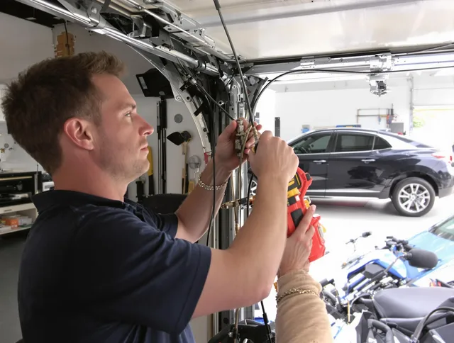 Wellington Garage Door Repair safety certified technician performing cable replacement in Wellington