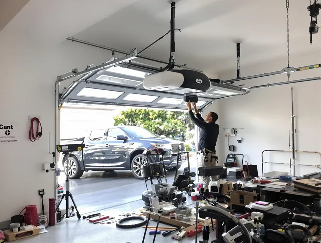 Wellington Garage Door Repair specialist installing smart garage door opener system in Wellington home