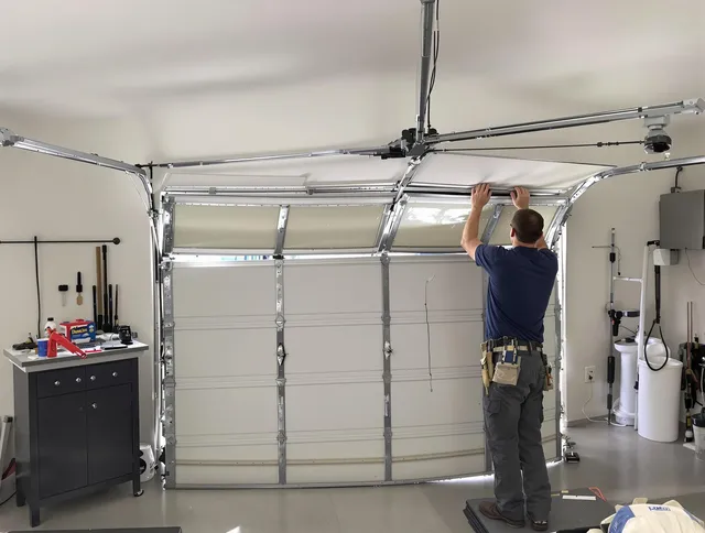 Wellington Garage Door Repair specialist performing precise section replacement on Wellington garage door